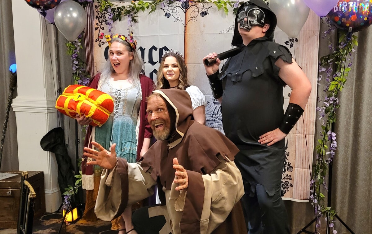 Close-up of costumed actors delivering dramatic lines in a murder mystery in Kennett Square