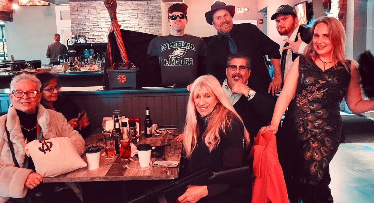Audience solving a Prohibition-era crime at a 1920s murder mystery in Hockessin DE