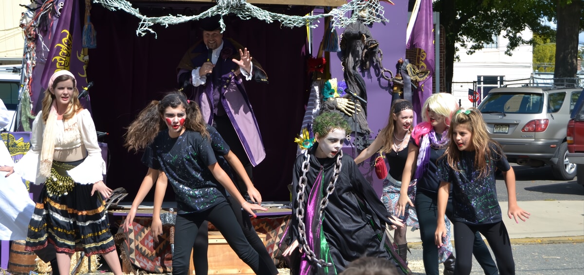 Actors performing a lively comedy show as part of outdoor entertainment in NJ & PA.