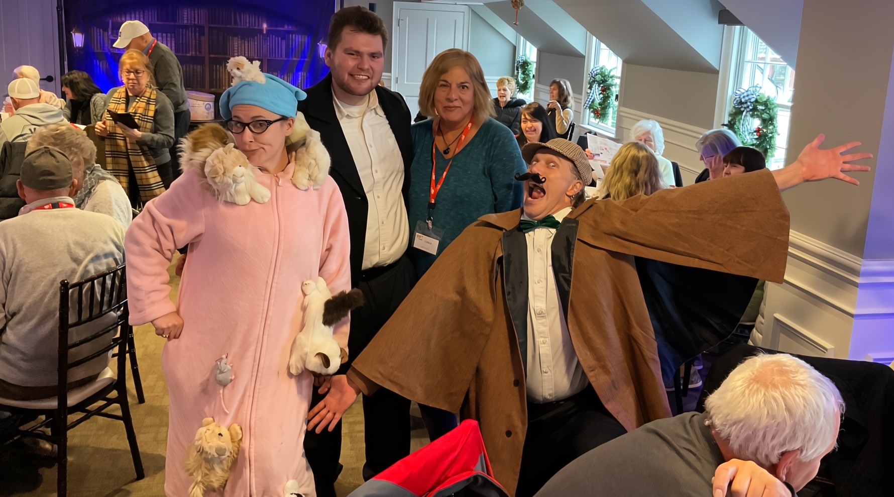 vibrant party scene with actors and guests enjoying a Peddlers Murder Mystery event.