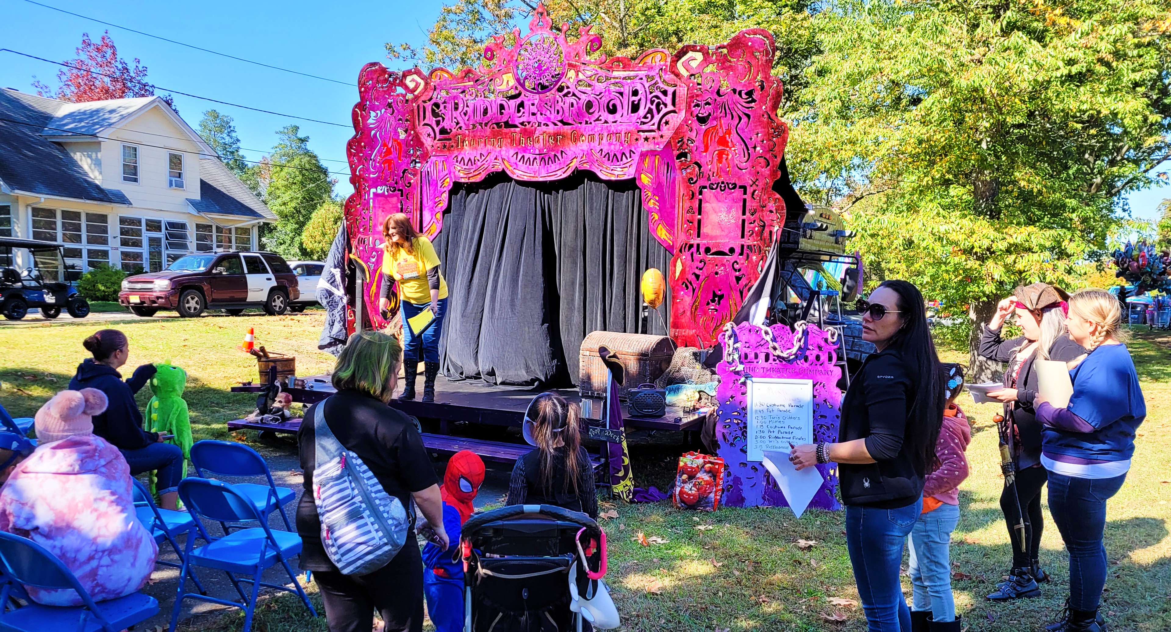 An outdoor stage set up at an RV park in NJ, featuring a dynamic cast of actors performing a show