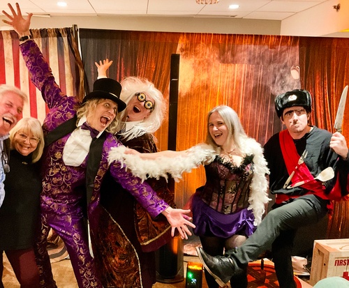 Audience members participate in solving a Houdini-themed murder mystery