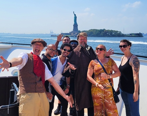 Actors reenacting a Sherlock Holmes murder mystery plot twist during an interactive show