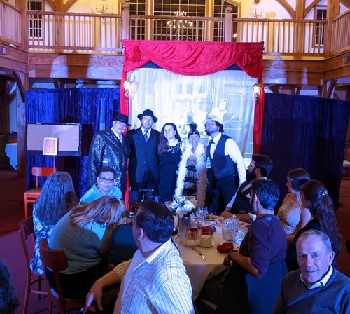 Speakeasy-inspired set design for a Roaring 20's gangster murder mystery event